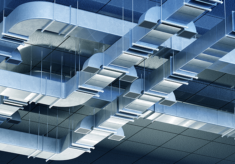 Metal HVAC ductwork and air vents mounted above a suspended ceiling